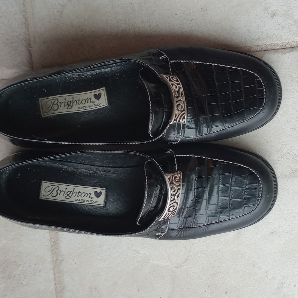 Black flat shoes with silver buckle